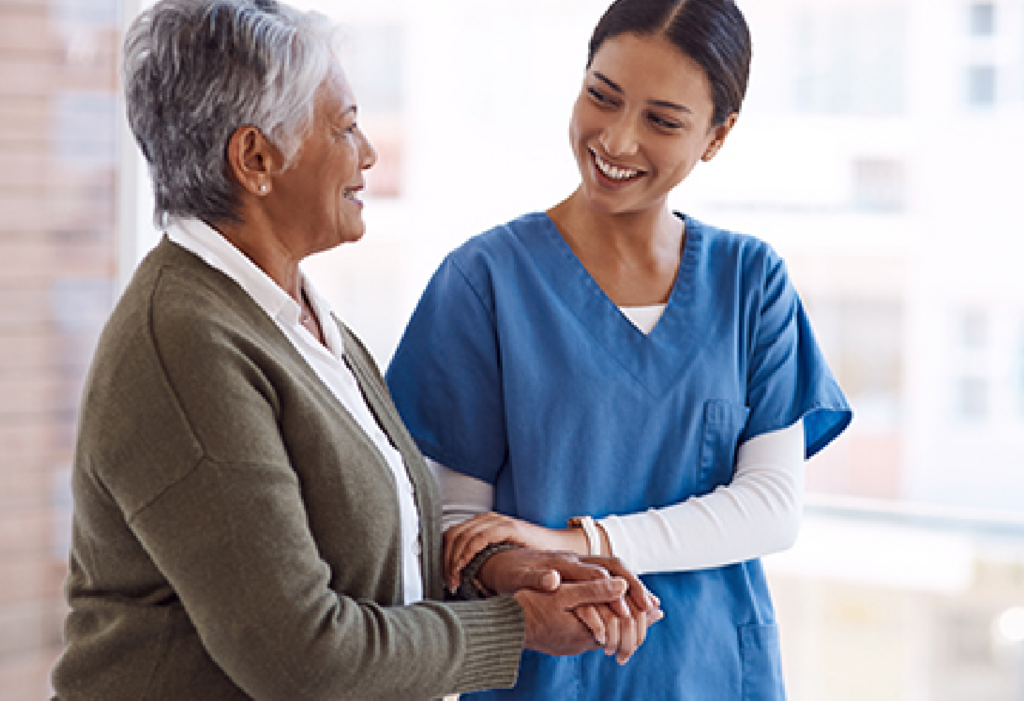 Senior woman walking with medical professional