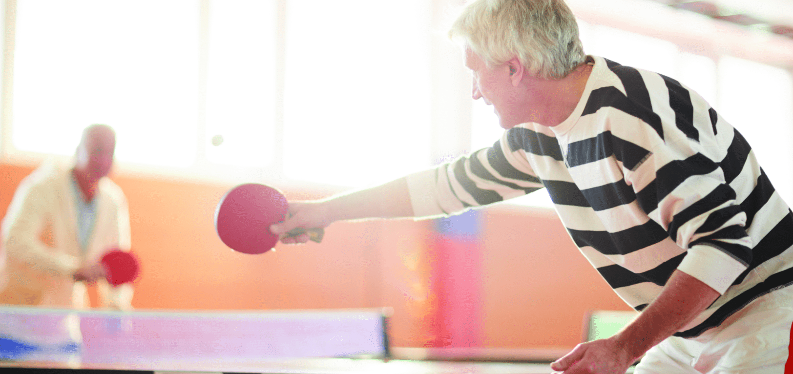 Senior men playing ping pong