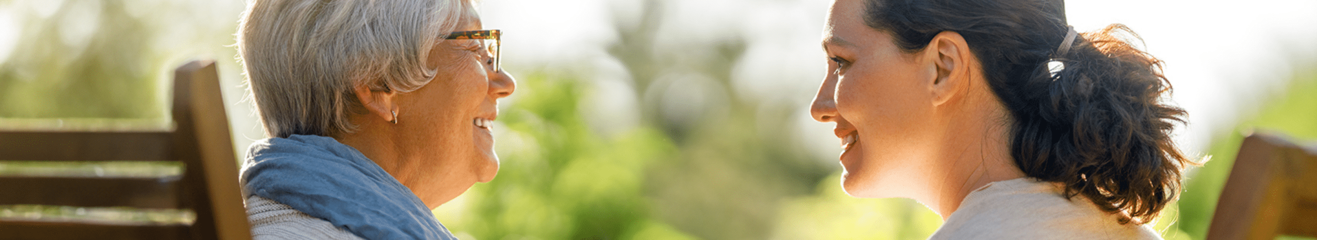 Senior woman talking with young woman