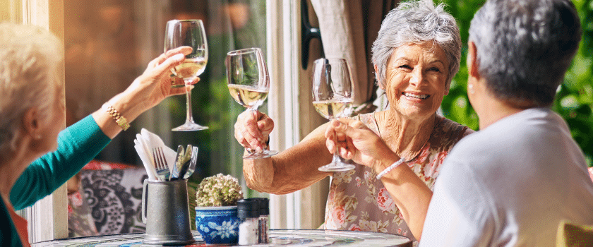 Plymouth Harbor on Sarasota Bay: Senior Women Enjoying Wine at a Table
