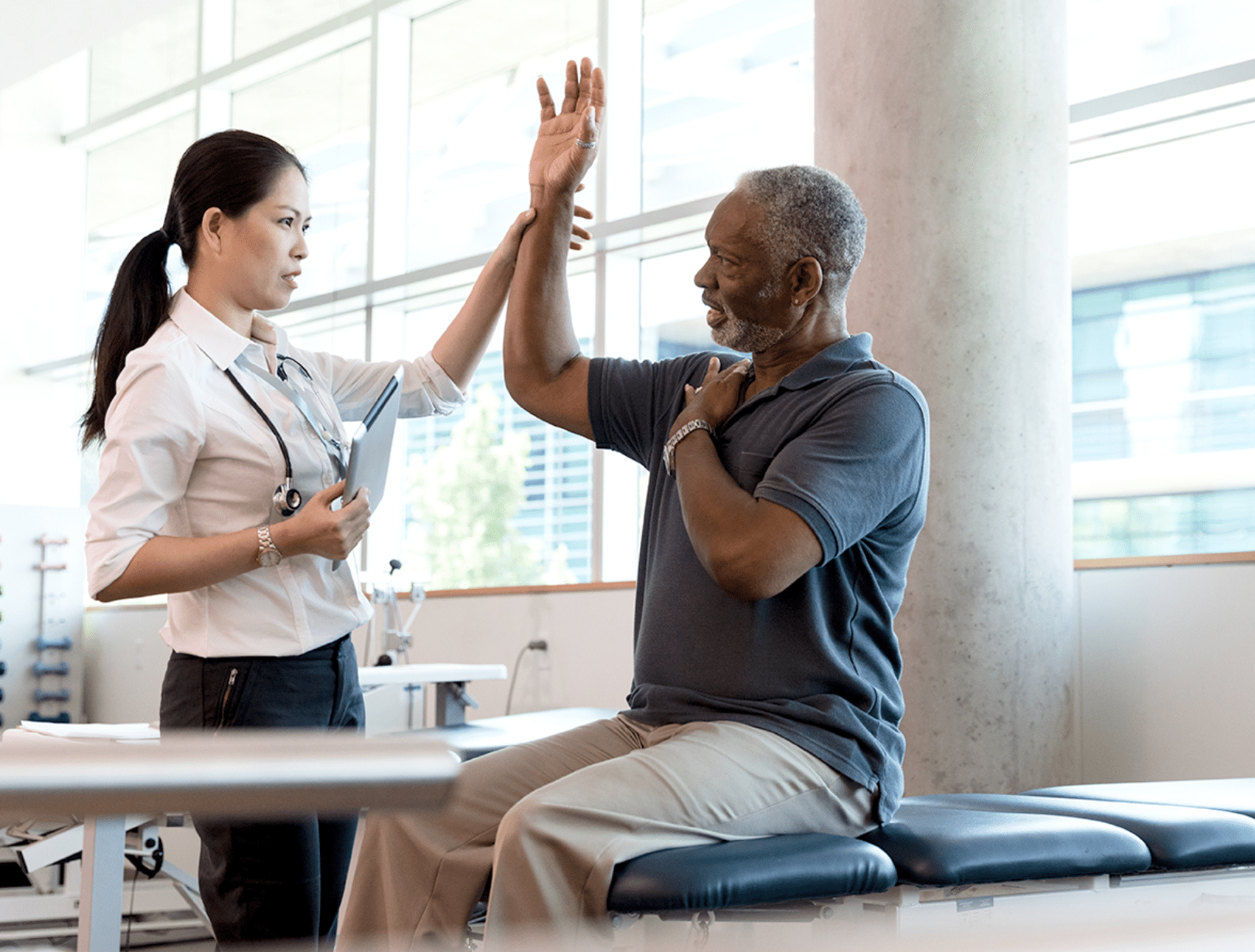 Plymouth Harbor on Sarasota Bay: Caregiver Evaluating Senior on Medical Table