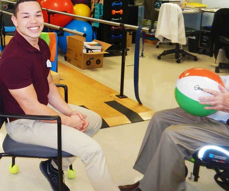 A member of Functional Pathways works with a Plymouth Harbor resident during a rehab session