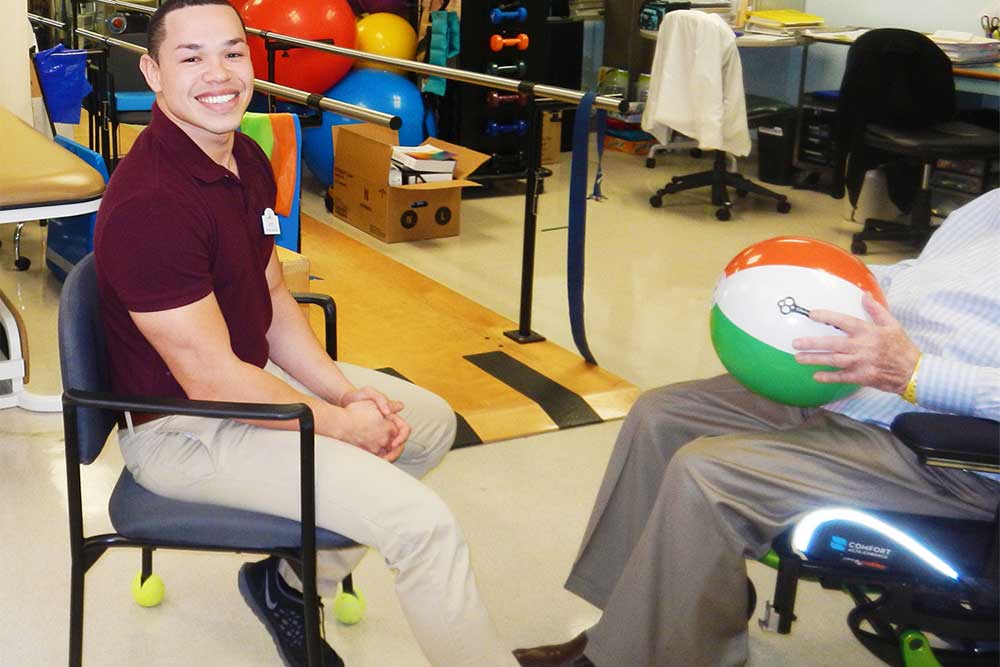 A member of Functional Pathways works with a Plymouth Harbor resident during a rehab session
