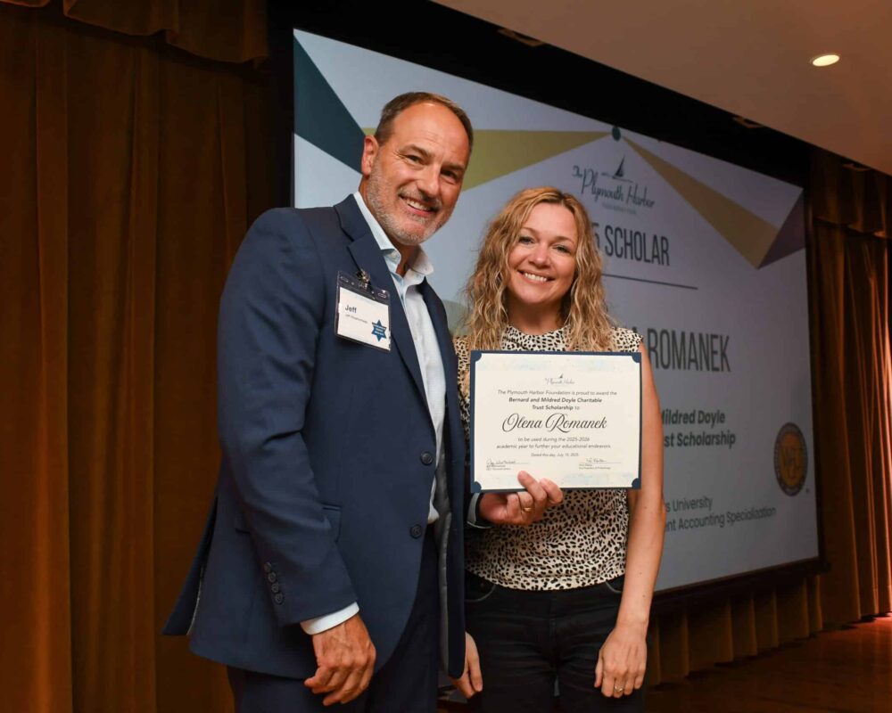 Jeff Weatherhead stands with scholarship recipient, Olena Romanek